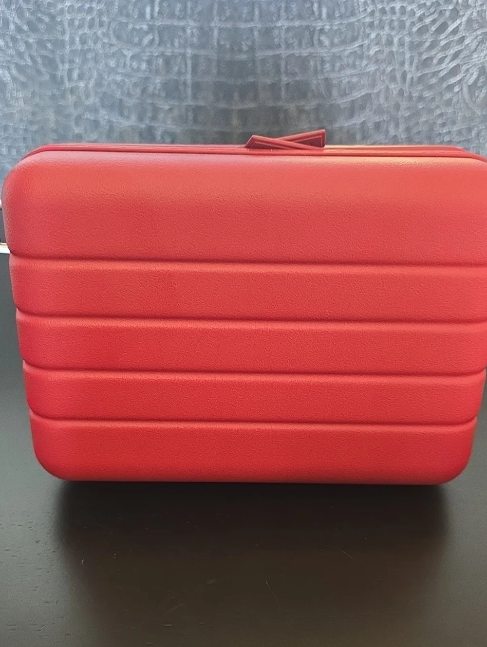 Away Small Hard-Shell Crossbody Case in  Tango Red with Matching Strap